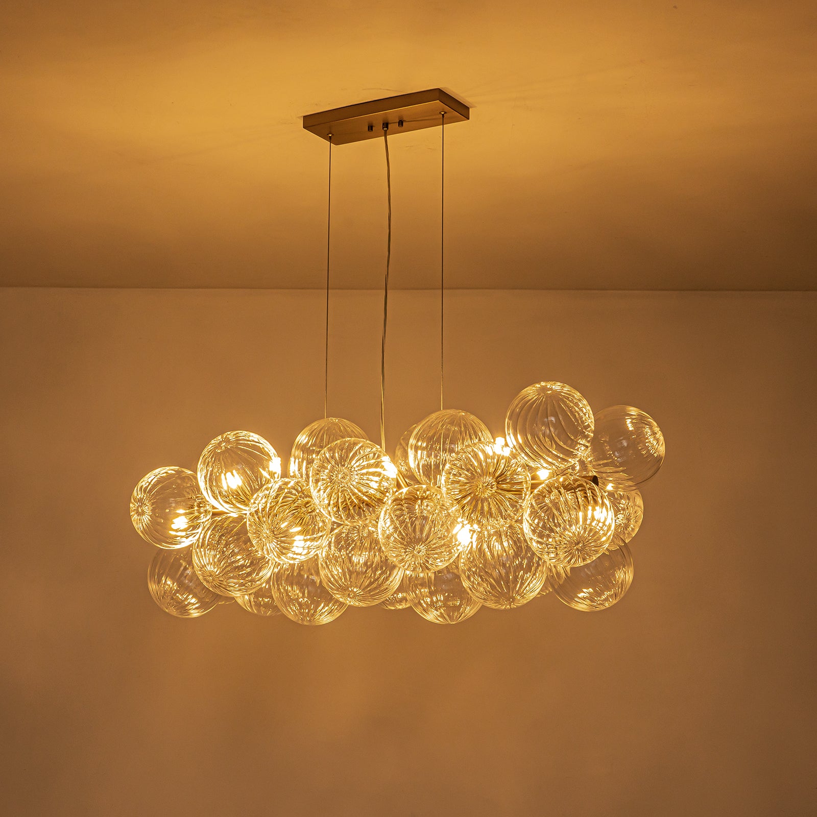 Glowlings 10-Light Modern 42"Wide Large Brass Linear Globe Ribbed Swirled Glass Chandelier
