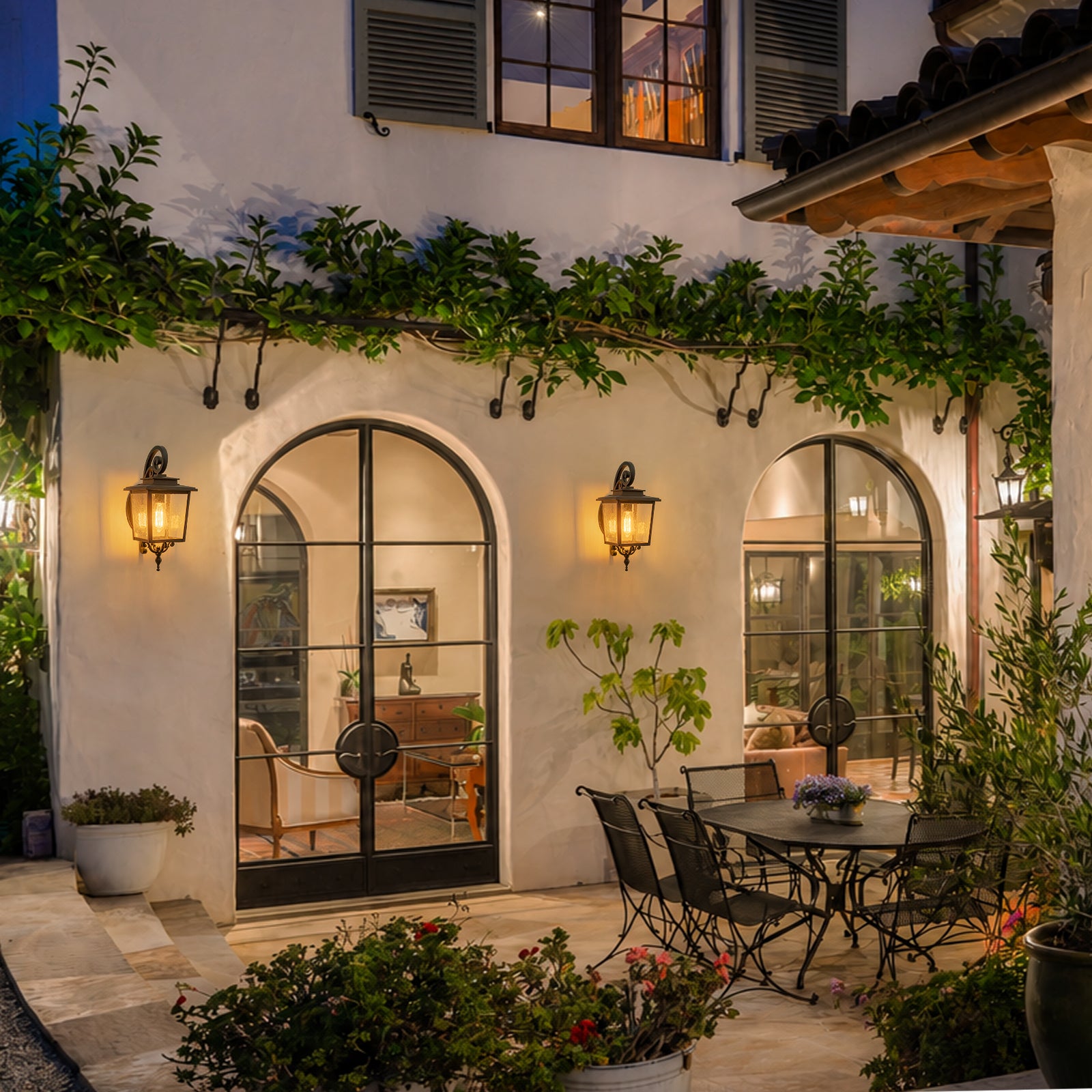 Glowlings 1-Light Traditional Lantern Outdoor Wall Sconce with Seeded Glass and Scroll Accent