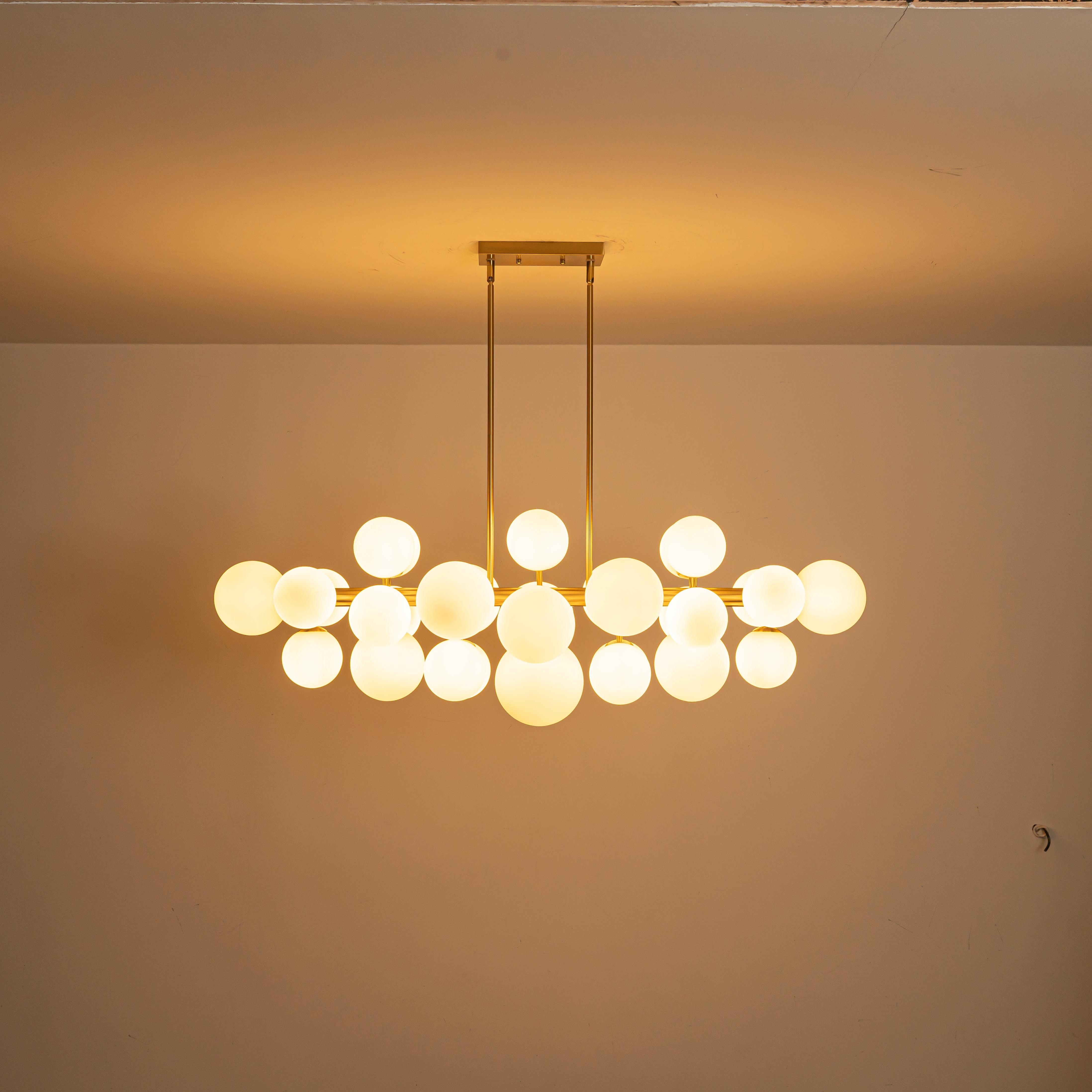 Glowlings 31-Light Modern Large Brass Linear Globe Bubbles Opal Glass Chandelier Kitchen Island Light