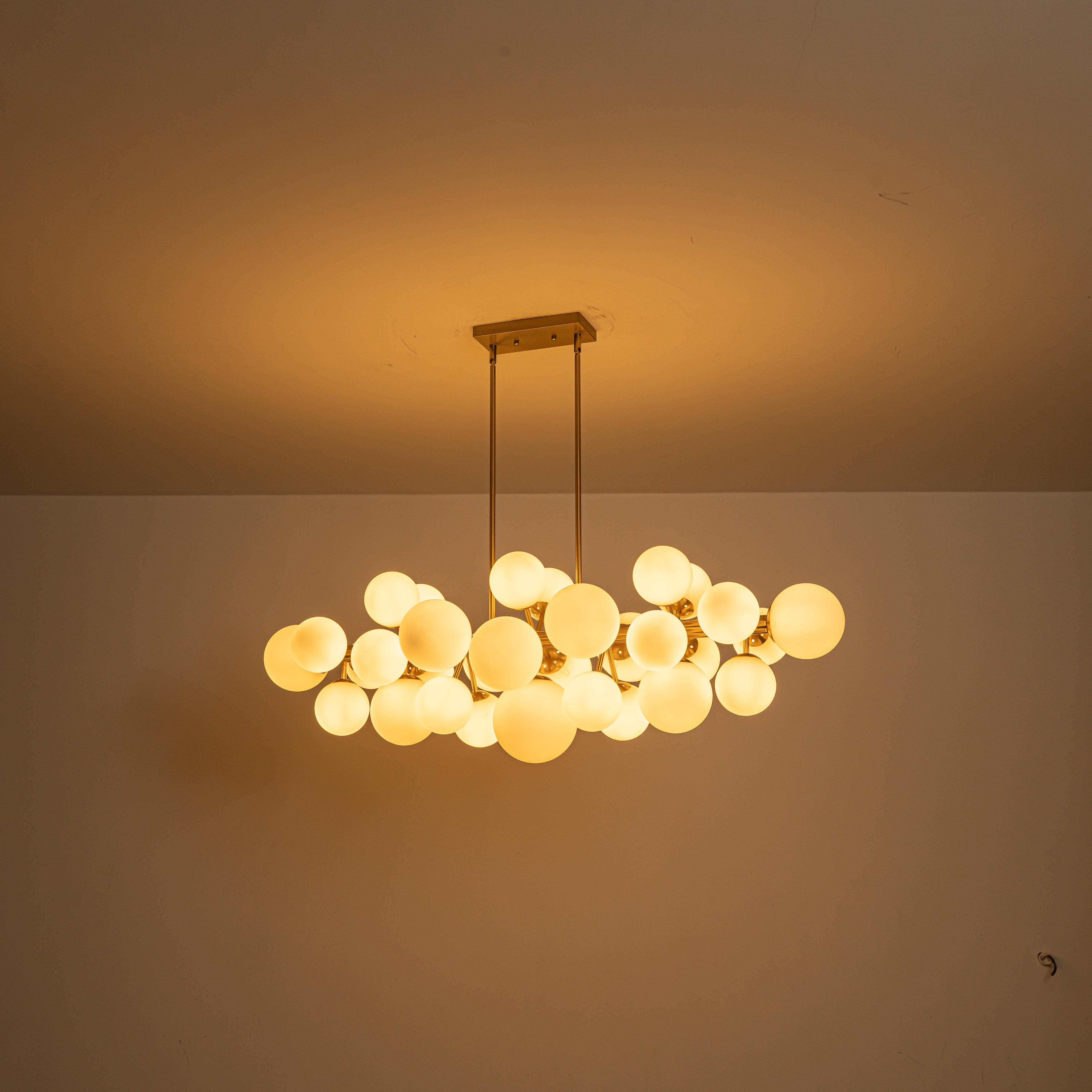 Glowlings 31-Light Modern Large Brass Linear Globe Bubbles Opal Glass Chandelier Kitchen Island Light