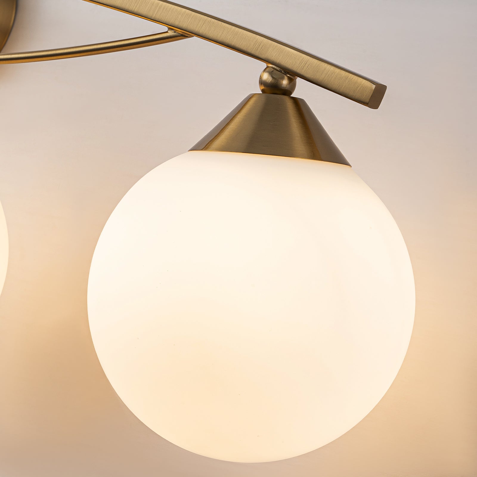 Glowlings 3/4-Light Modern Brass Curve Opal Glass Bathroom Vanity Light