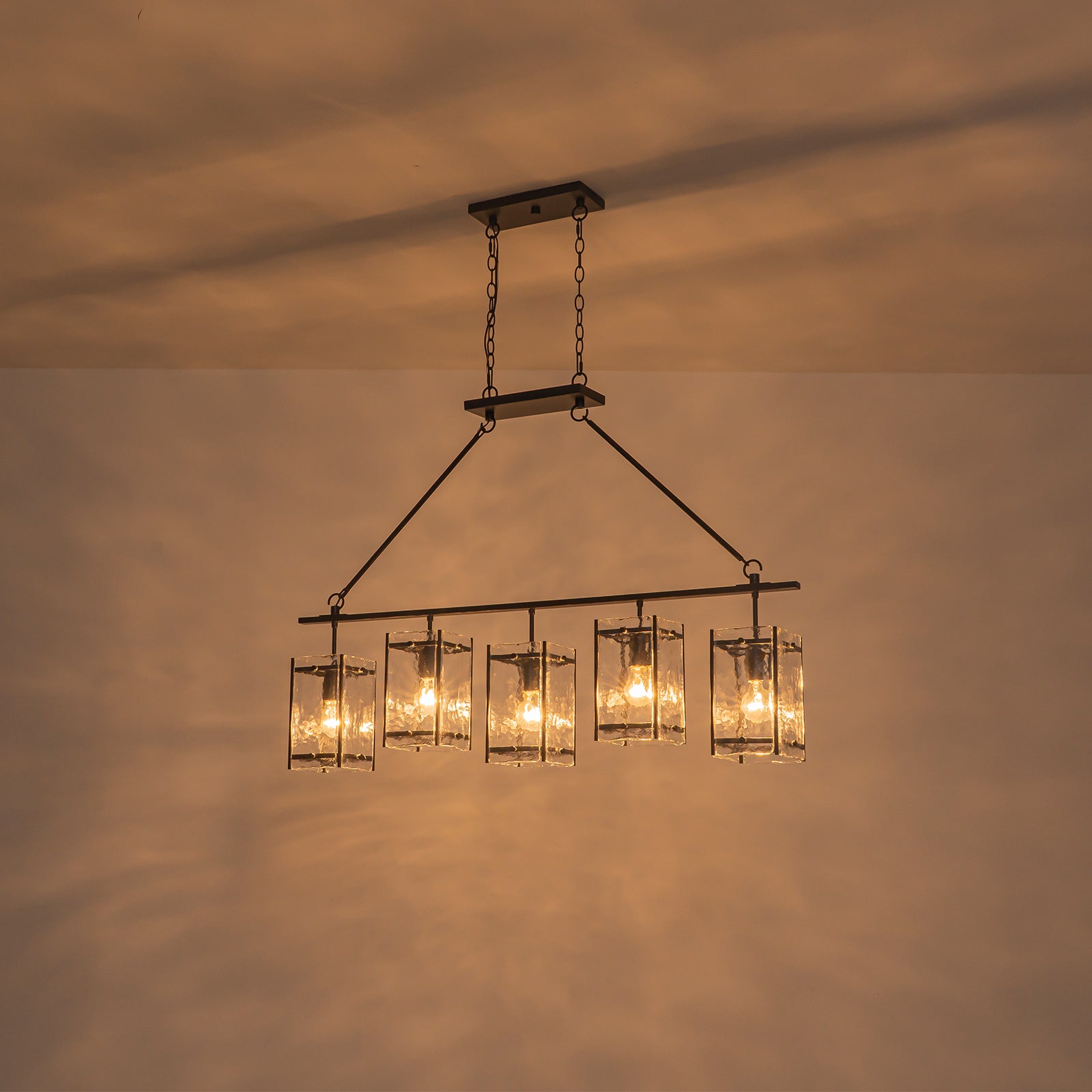 Glowlings 5-Light Modern Kitchen Island Chandelier, Matte Black Linear Pendant Light with Handblown Water Ripple Glass