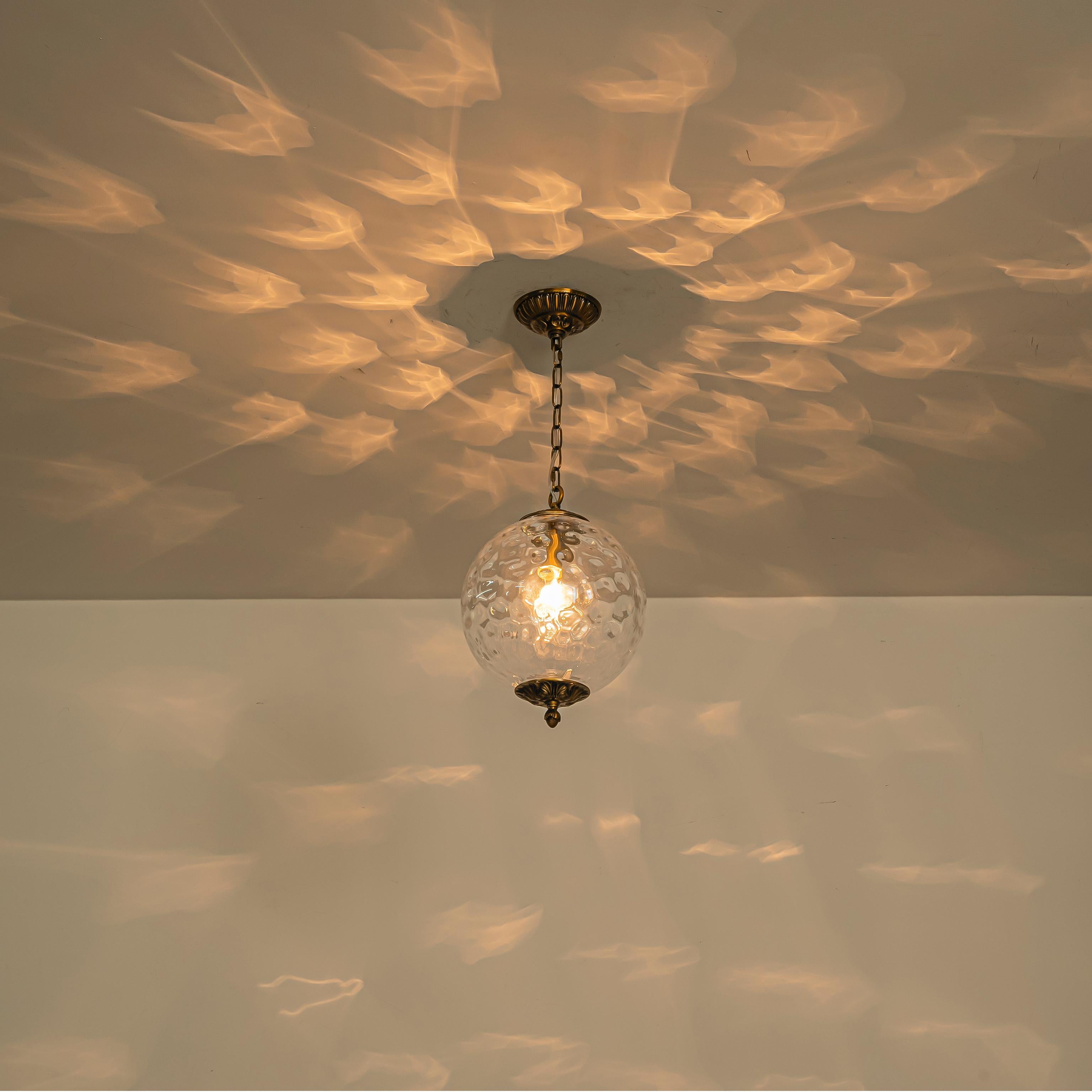 Glowlings 1-Light Classic Aged Brass Clear Hammered Glass Globe Pendant Light