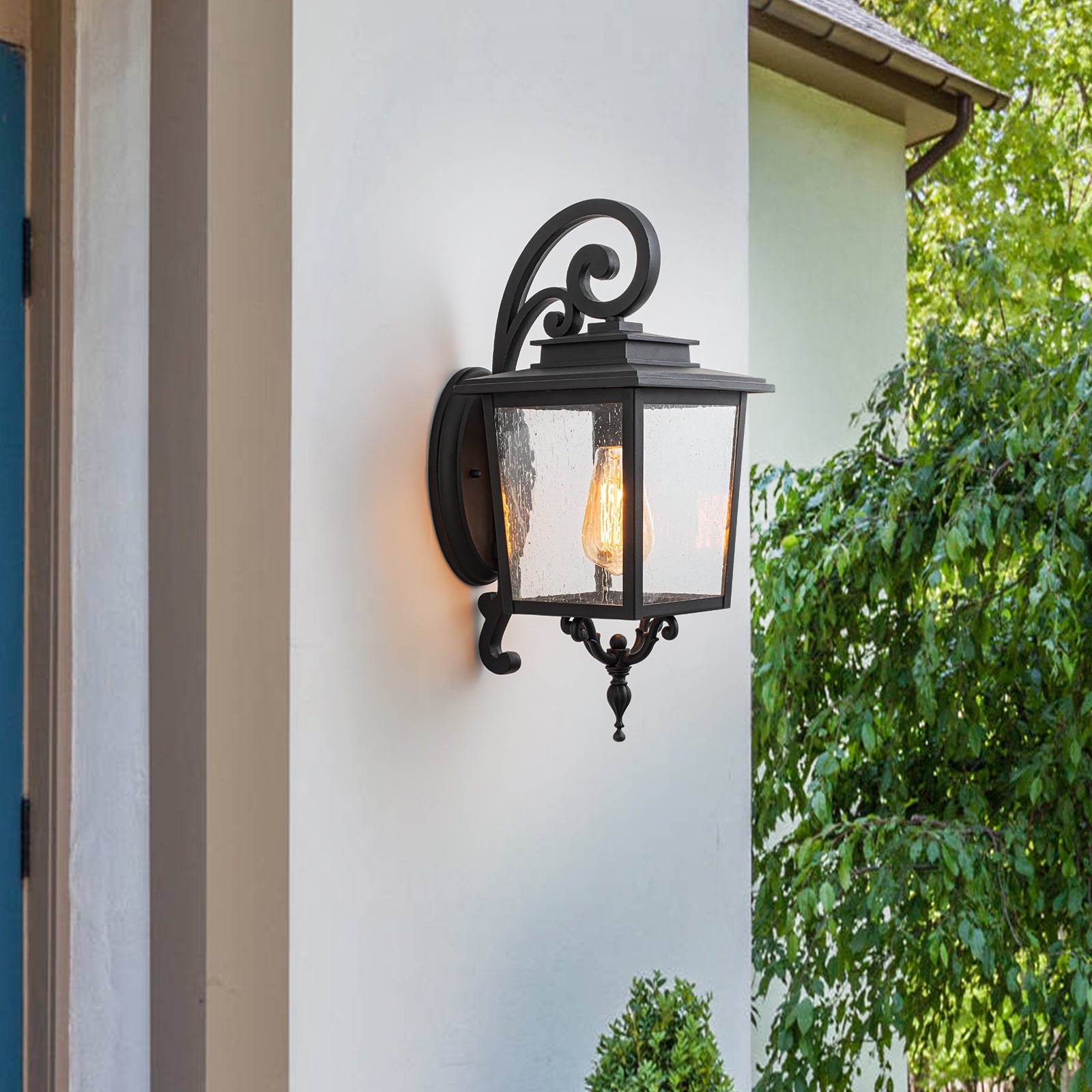 Glowlings 1-Light Traditional Lantern Outdoor Wall Sconce with Seeded Glass and Scroll Accent