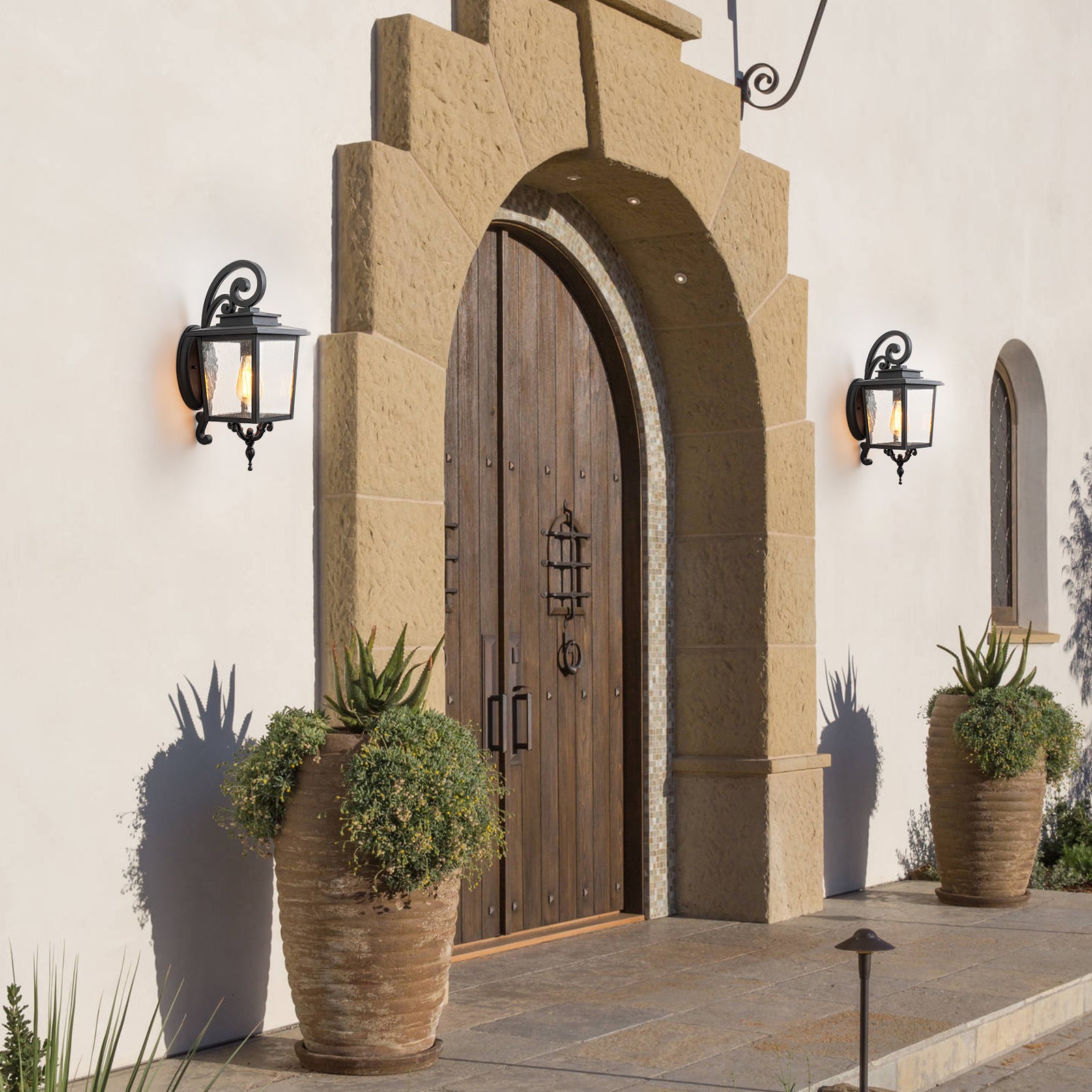 Glowlings 1-Light Traditional Lantern Outdoor Wall Sconce with Seeded Glass and Scroll Accent